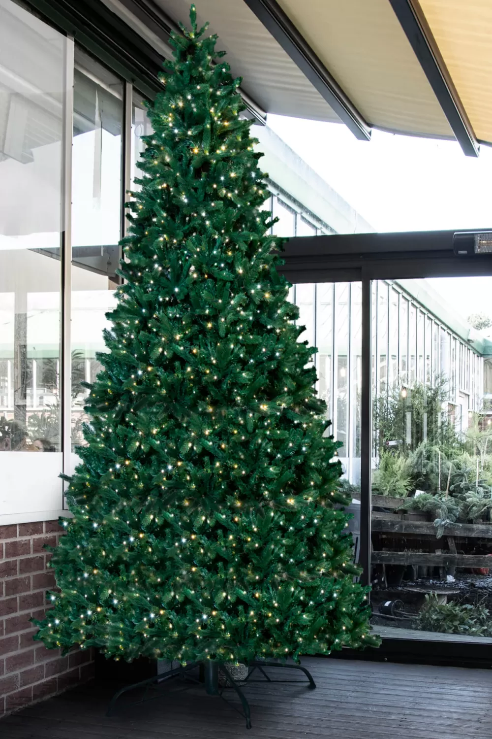 Christmas Tree World The 10ft Pre-lit Ultra Devonshire Tree - 4.6ft Wide - Warm White/Bright White Colour Change Lights< Large Commercial Christmas Trees | 10 Foot Pre Lit Christmas Trees